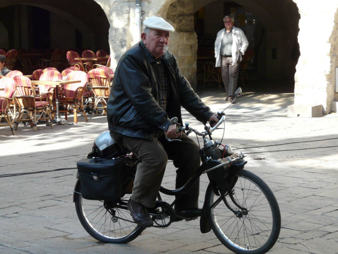 We won't be using this postman to send the brochure, though he looks typical!